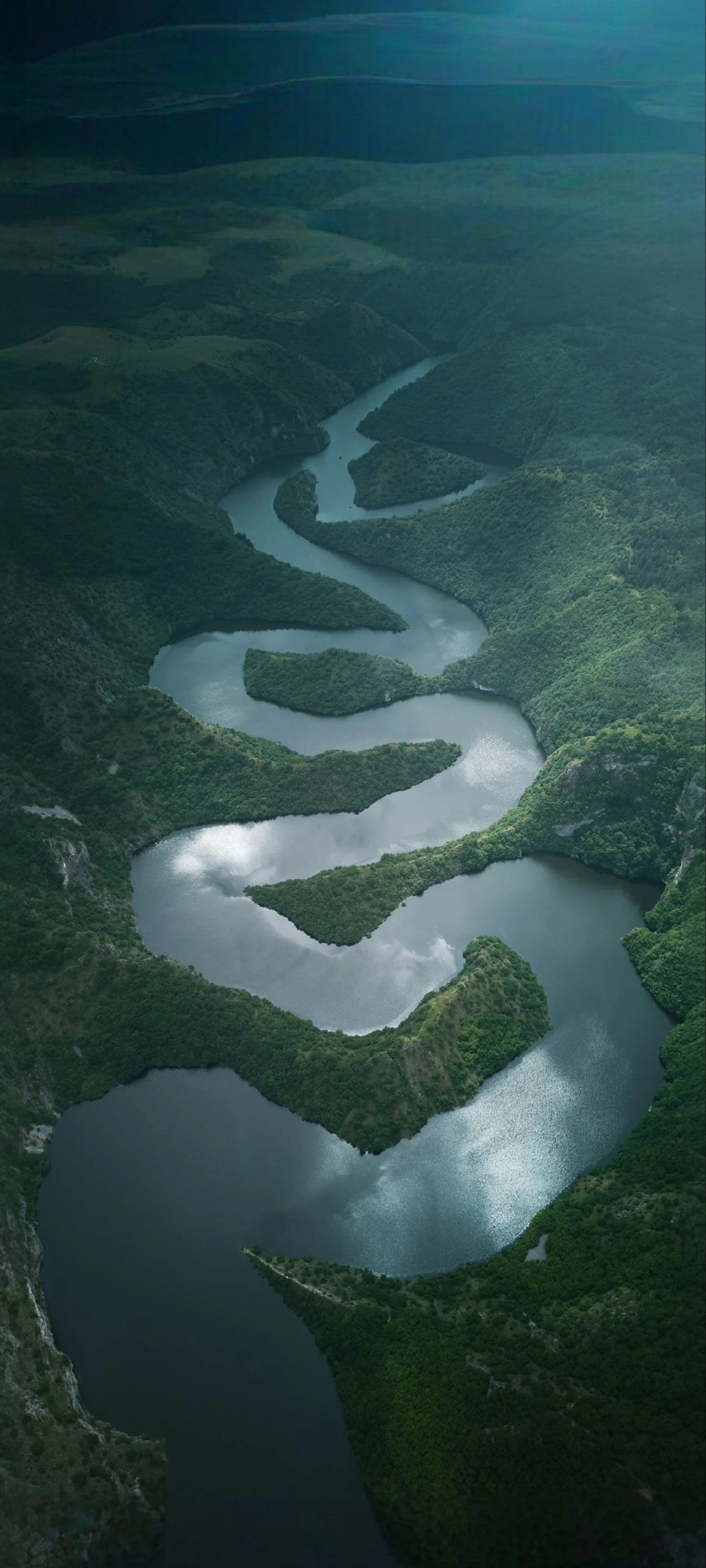 Aerial View of a Winding River Valley Landscape