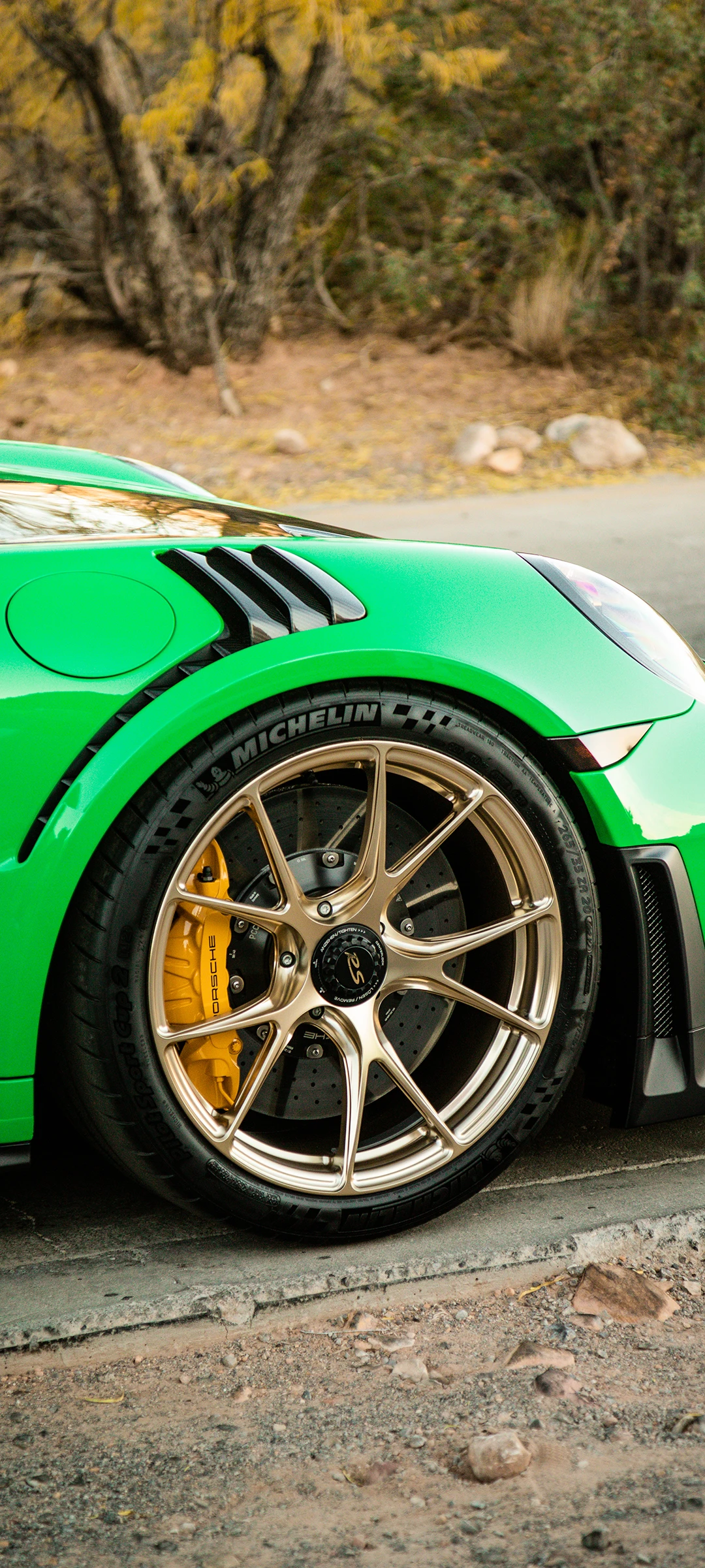 Close-up of Lime Green Car with Golden Rims