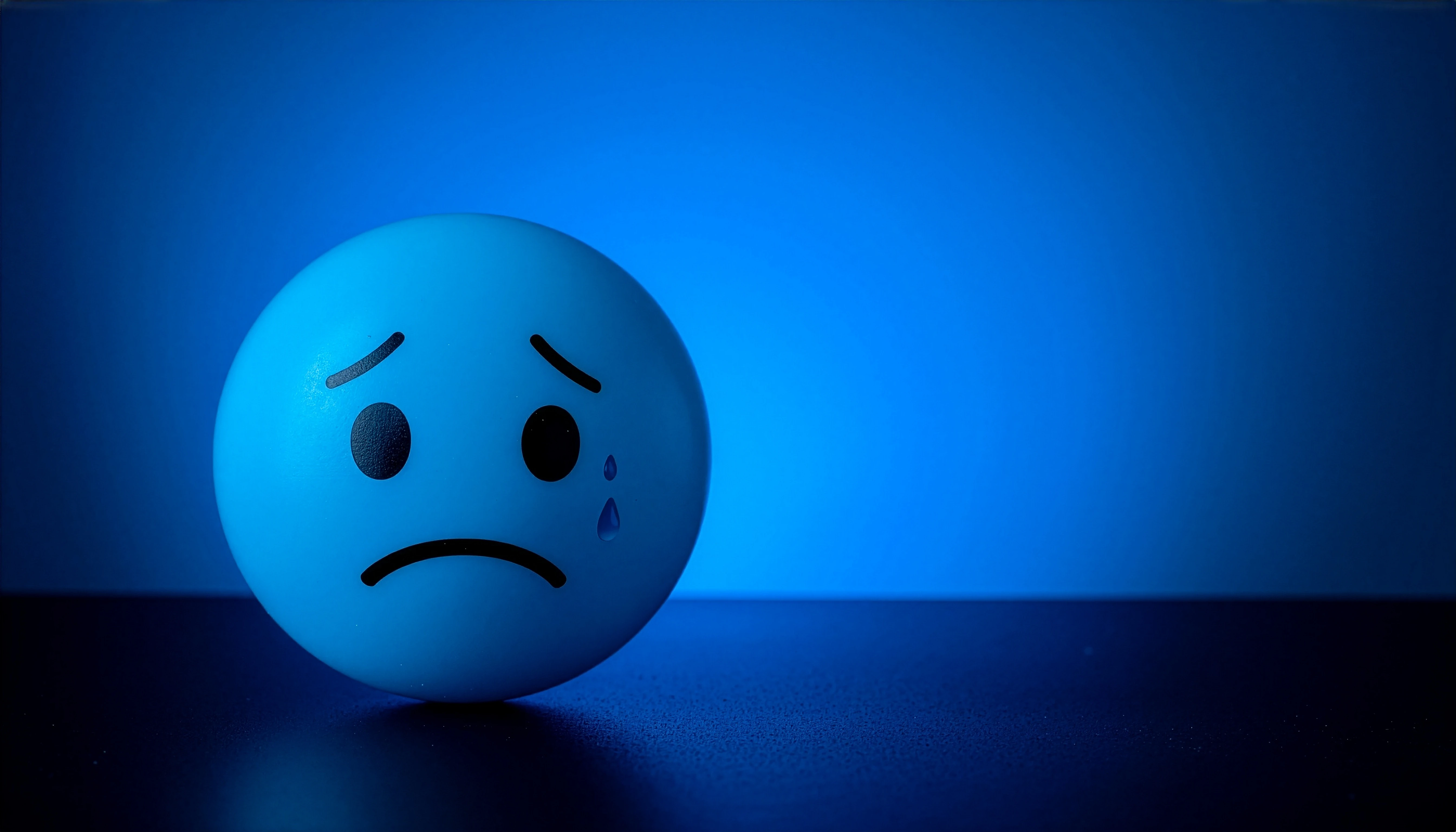 Melancholy Blue a Sad Emoji Ball Portrait Abstract wallpaper 5376x3072
